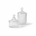 Dos carameleras de cristal transparente WISHFUL con diseños labrados y tapas decorativas sobre fondo blanco