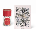 Puzzle de 100 piezas WISHFUL con diseño botánico de pavo real y flores, presentado en un tubo cilíndrico decorativo.